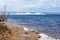 Natural ice blocks breaking up against shore during spring weather. Arctic, winter, spring landscape. Ice drift