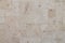 Natural Italian stone. Smooth travertine surface. A sample of wall cladding with natural stone.