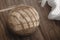 Natural jute braided pouf on the hardwood floor in natural sunlight