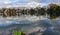 Natural Landscape, Reflection of clouds and lodges in the water of a quiet lake in New Jersey