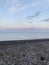 Natural landscape of the sea coast, pebble beach.