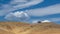 Natural landscape of Tejon ranch covered by dried grass with lonely tree in distance under blue sky