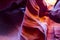 Natural landscapes of vibrant sandstones stacked in flaky fire waves in a narrow sandy labyrinth in Lower Antelope Canyon in Page