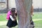 Natural learning. Happy kid look at squirrel climbing tree trunk. Environmental education. Natural science. Zoology