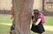 Natural learning. Happy kid look at squirrel climbing tree trunk. Environmental education. Natural science. Zoology