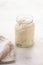 Natural leaven for bread in a glass jar. A living product. The concept of a healthy diet. Sourdough starter