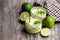 Natural lime yogurt in a small glass jar on wooden table