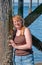 Natural Looking Middle Aged Woman Portrait with Ocean Pillings