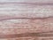 Natural material of wooden block plank in brown color with pattern of lines used in rustic flooring and with rough texture