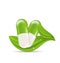 Natural medical pills with green leaves,