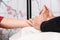 Natural medicine, reflexology acupressure foot massaging.