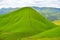 Natural mountainous landscape, no tree, blue sky, green grass, Xaysomboun Province, Lao PDR