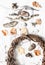 Natural nature objects for creative crafts - vine wreath, stones, leaves, wood on a light background, top view.