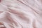 Natural nude gentle pink, light pastel textile cloth background, crumpled wavy texture