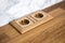 Natural oak wood socket built in natural wood kitchen counter.