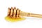 Natural olive wood dipper with honey isolated