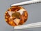 natural orange grossular garnet gem on the background