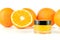 Natural orange sugar lip scrub on white.