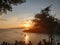 Natural Orange Sunset Colorful Sky lake.Sun Over Skyline Mountain Water in crest shape and beautiful clouds