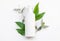 Natural organic cosmetic packaging plastic mock up with leaves. Mock-up bottle for branding
