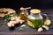 natural organic herbal tea in glass teapot on a wooden table