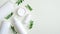 Natural organic SPA cosmetic products set with green leaves. Top view herbal skincare beauty products on green background. Banner