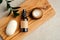 Natural organic SPA cosmetic products set with green leaves on wooden board. Top view herbal skincare beauty products. Packaging