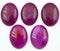 Natural oval cabochon purple agate on the white background