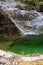 Natural path of Val Falcina at Valle del Mis in Italy. Cadini of Brenton, Sospirolo, with blue azure clear water and multiple