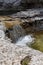 Natural path of Val Falcina at Valle del Mis in Italy. Cadini of Brenton, Sospirolo, with blue azure clear water and multiple