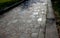 Natural paving of gneiss and granite irregular stones folded into a beautiful pattern where larger stones are surrounded by smalle