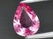 natural pink spinel gem on the background