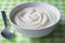 Natural plain white Greek yoghurt in bowl closeup - Yogurt background