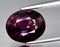 natural purple sapphire gem on the background