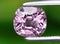 natural purple spinel gem on the background
