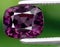 natural purple spinel gem on the background