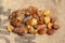 Natural raw amber stones on jute bag background. Multiple amber gemstone in various shapes and colour. Jewelry components.