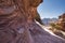 natural red desert sandstone stone texture on a hiking trail in the ancient city of Petra