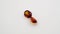 natural red hessonite garnet gemstone on the white background on the turning table