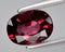 natural red rhodolite garnet gem on the background