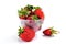 Natural ripe strawberries in a misted transparent cup with drops of water on a white background, juicy berries, vitamin smoothie,