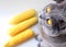 Natural ripe young yellow corn and a gray domestic cat eating sweet corn.