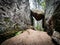 Natural rock formation, big stone stuck between two rocks