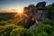 natural rock formation surrounded by lush greenery, with view of the sun rising over the horizon