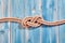 Natural Rope Double Figure Eight Knot on Blue Wood