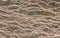 Natural sandstone rock rippled textured rock surface ideal as background