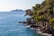 Natural sea panorama in the mediterranean sea in northern italy near the city of Rapallo. Seascape coast with ancient brick wall