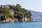 Natural sea panorama in the mediterranean sea in northern italy near the city of Rapallo. Seascape coast with ancient brick wall