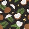 Natural seamless pattern with whole and split coconuts, flowers and exotic palm leaves on black background. Tropical