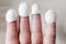 Natural silk cocoons wear on tips of fingers